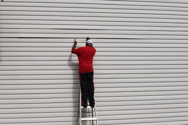 Loose Siding Repair in Cypress